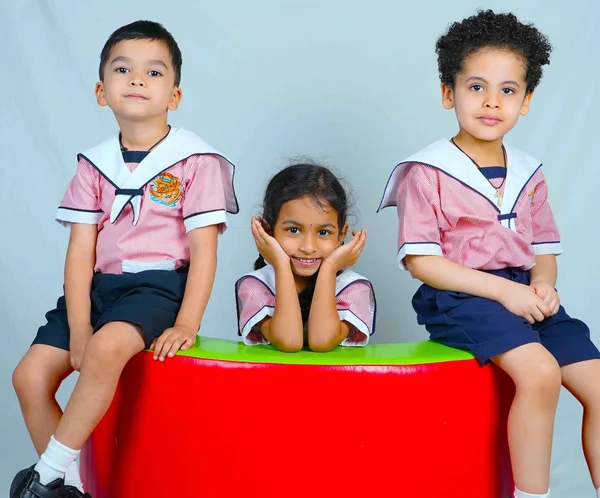 Children seated together during a nursery activity